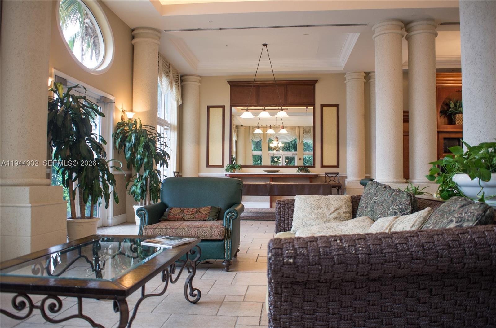 17145 North Bay Road, Unit 4312 Sunny Isles Beach, FL 33160 - Photo 22 of 33 a living room with furniture and a large window