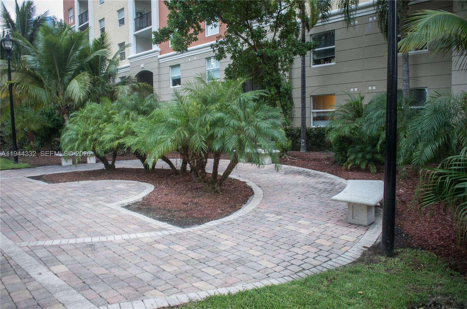 17145 North Bay Road, Unit 4312 Sunny Isles Beach, FL 33160 - Photo 30 of 33 a view of a yard with plants and trees