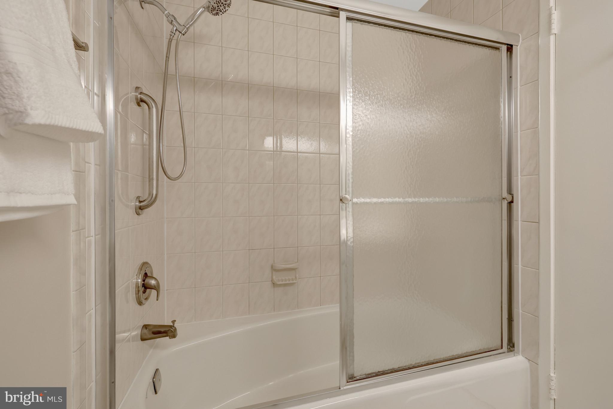 1600 Wainwright Drive Reston, VA 20190 - Photo 37 of 55 The full hall bathroom has a shower/tub with tile.