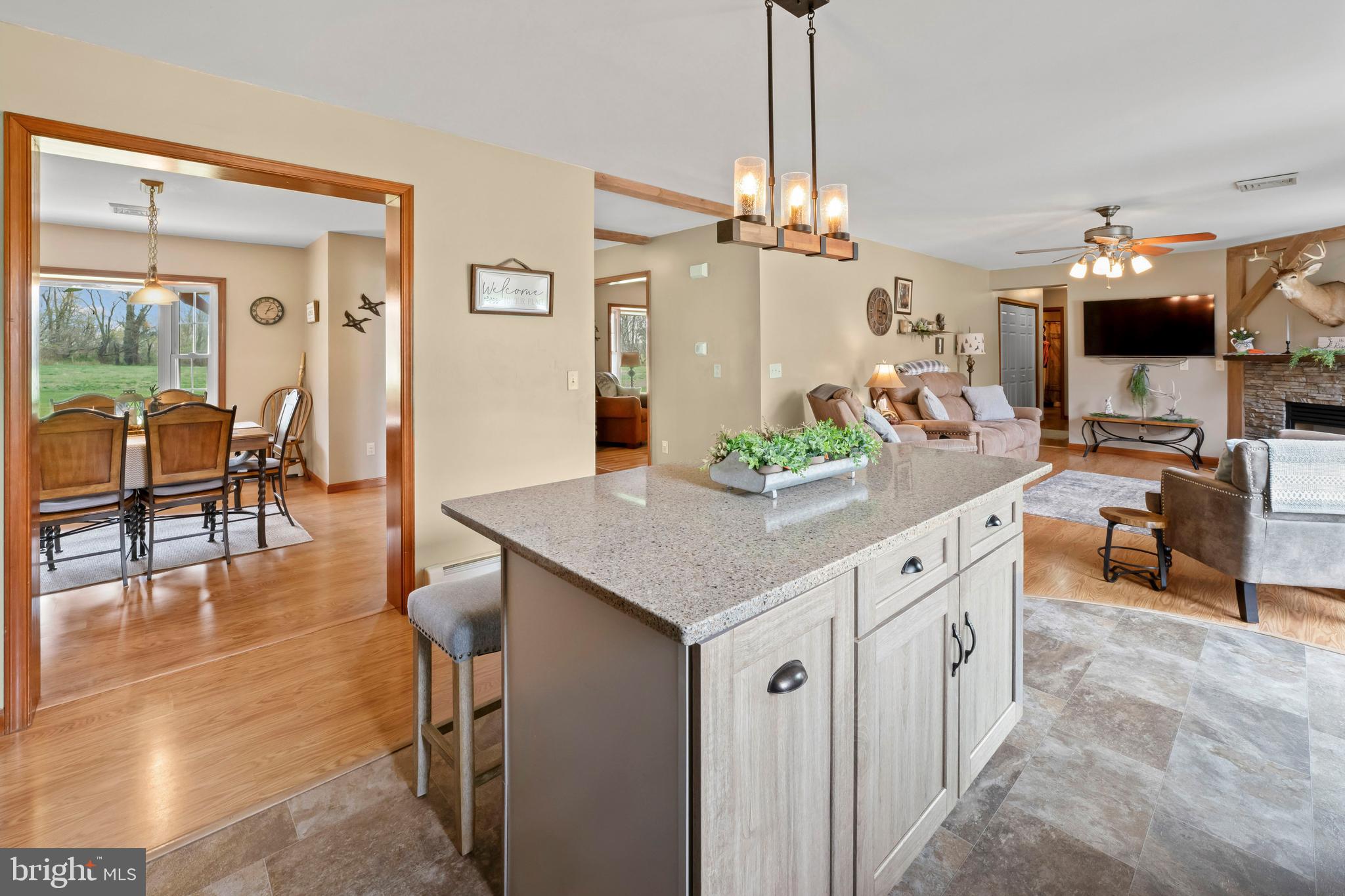 143 County Home Road Pilesgrove, NJ 08098 - Photo 20 of 51 a open kitchen with stainless steel appliances granite countertop a stove refrigerator and chairs
