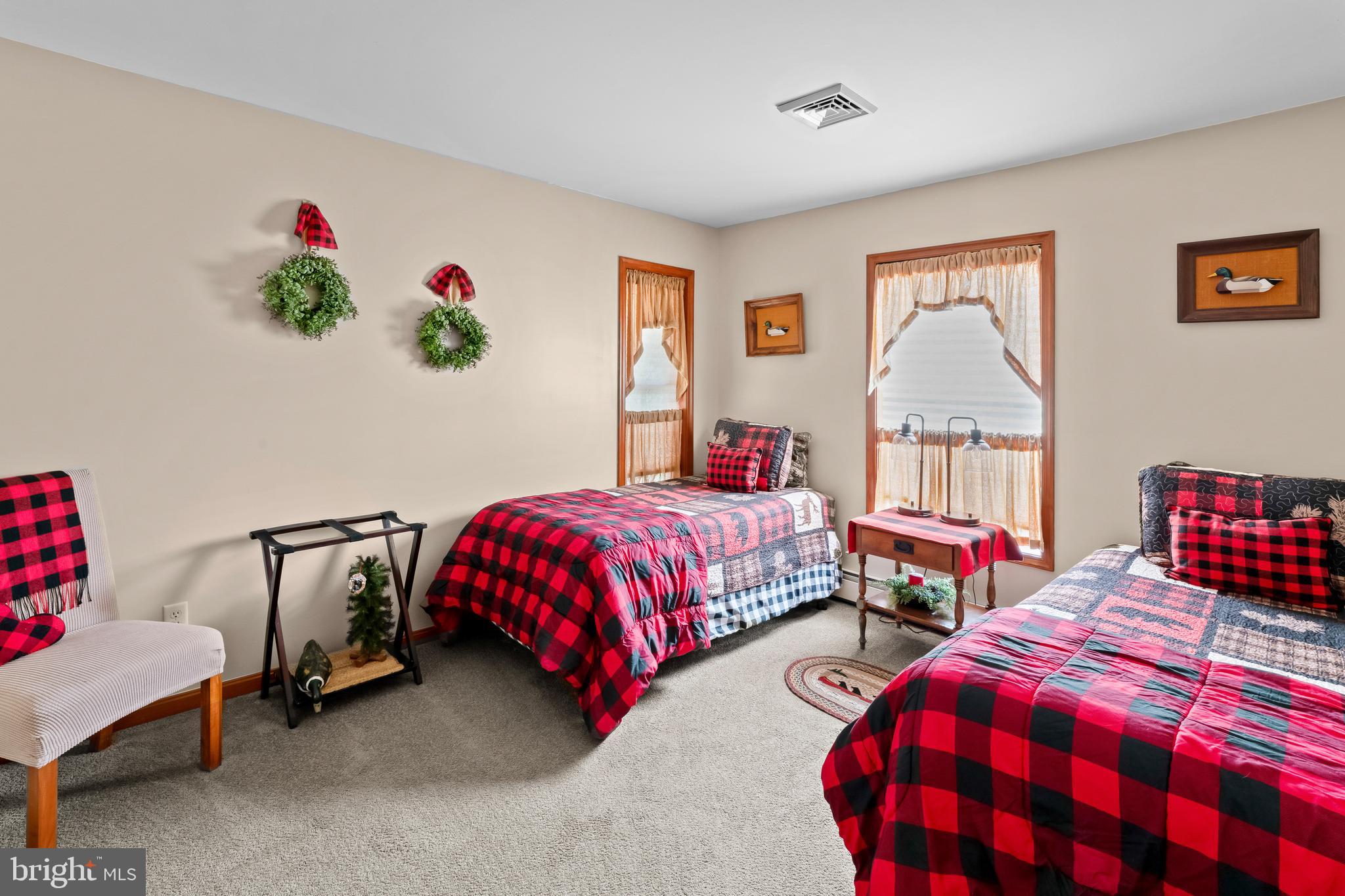 143 County Home Road Pilesgrove, NJ 08098 - Photo 32 of 51 a bedroom with two beds and a couch