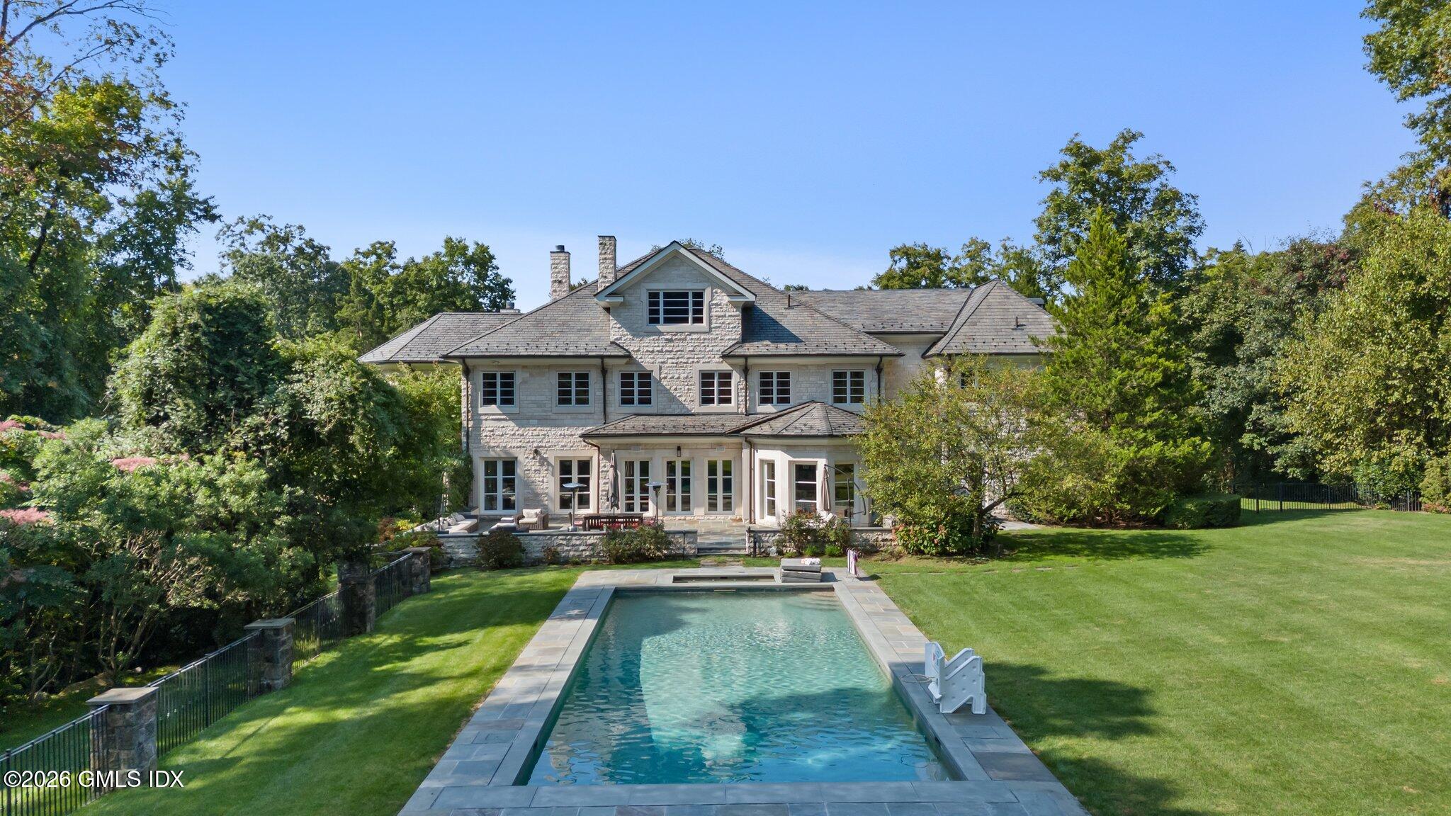 a view of a house with a swimming pool