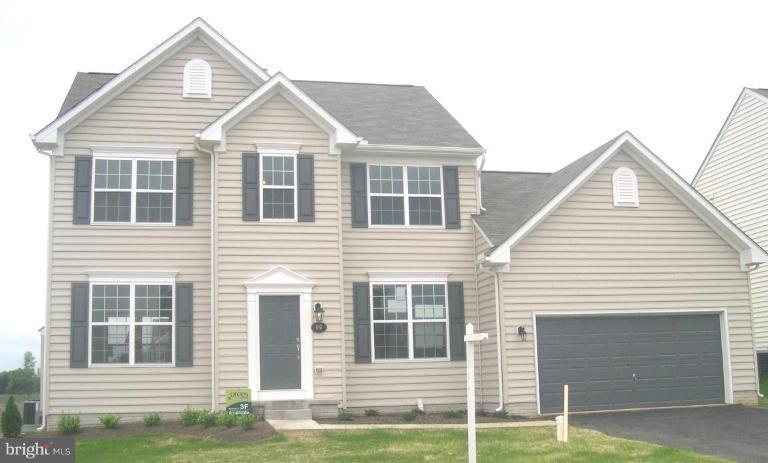 96 Glenbrook Road Ranson, WV 25438 - Photo 1 of 10 a front view of a house with a yard