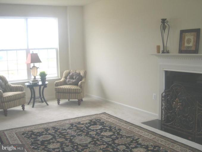 96 Glenbrook Road Ranson, WV 25438 - Photo 6 of 10 a living room with furniture a rug and a window