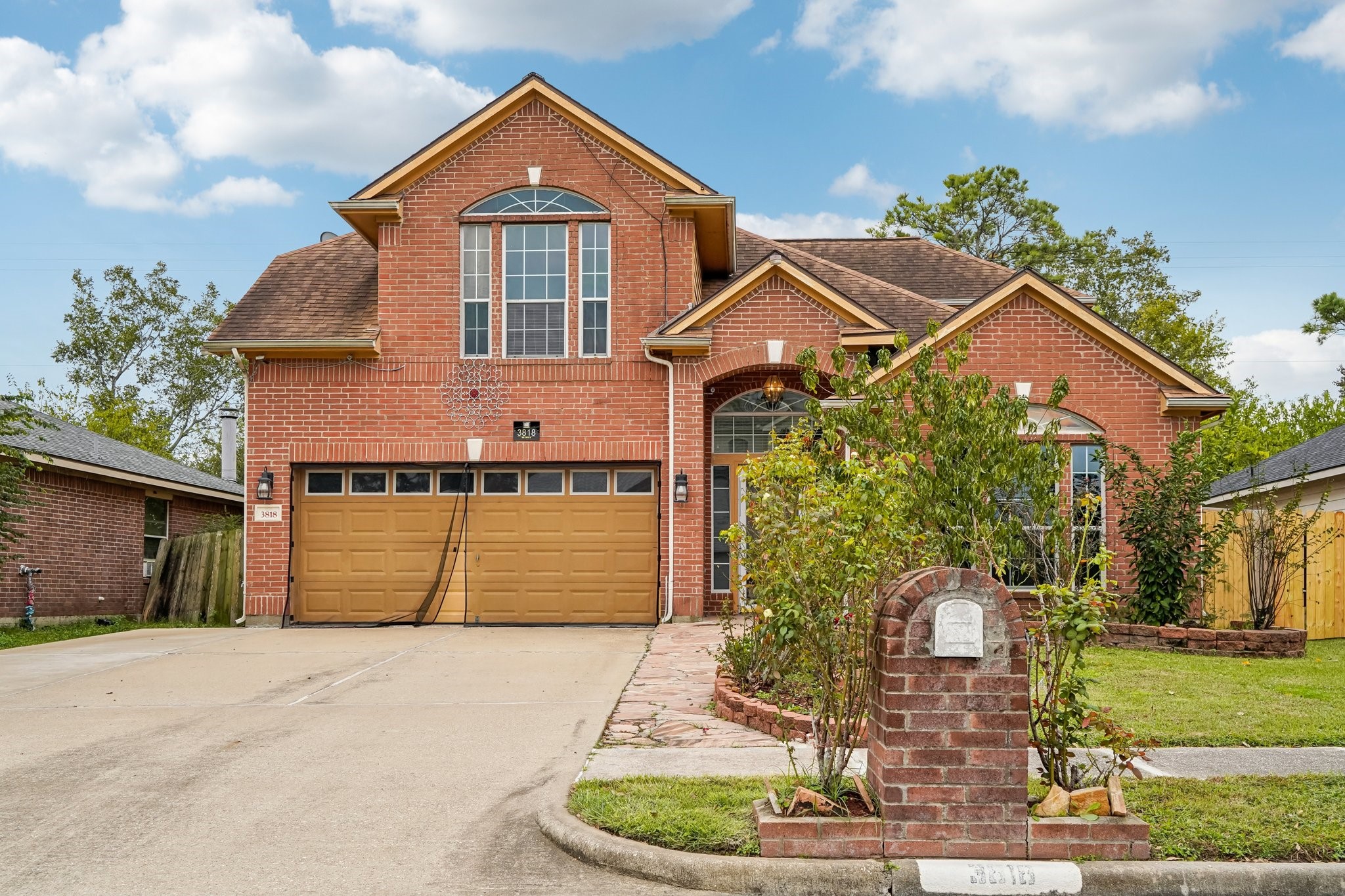 3818 Ridge Canyon Road Baytown, TX 77521 - Photo 1 of 32 a front view of a house with a yard and garage