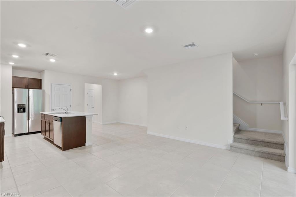 15535 Wildflower Circle Naples, FL 34119 - Photo 11 of 33 a view of kitchen and refrigerator