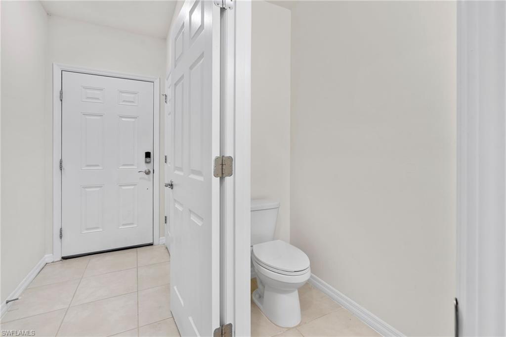 15535 Wildflower Circle Naples, FL 34119 - Photo 13 of 33 a bathroom with a toilet and a shower