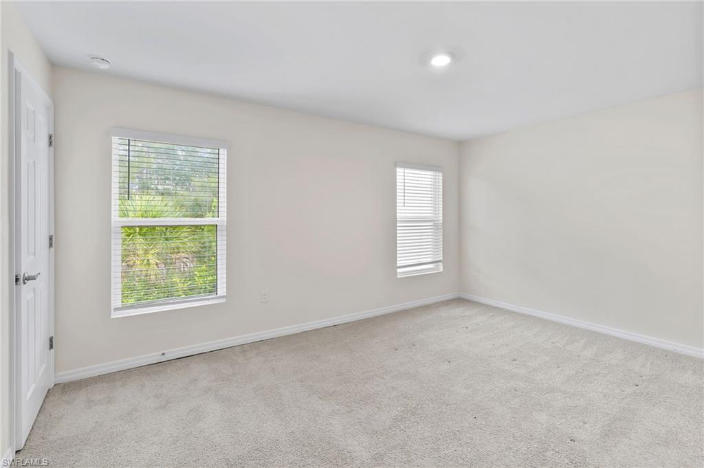 15535 Wildflower Circle Naples, FL 34119 - Photo 16 of 33 an empty room with windows