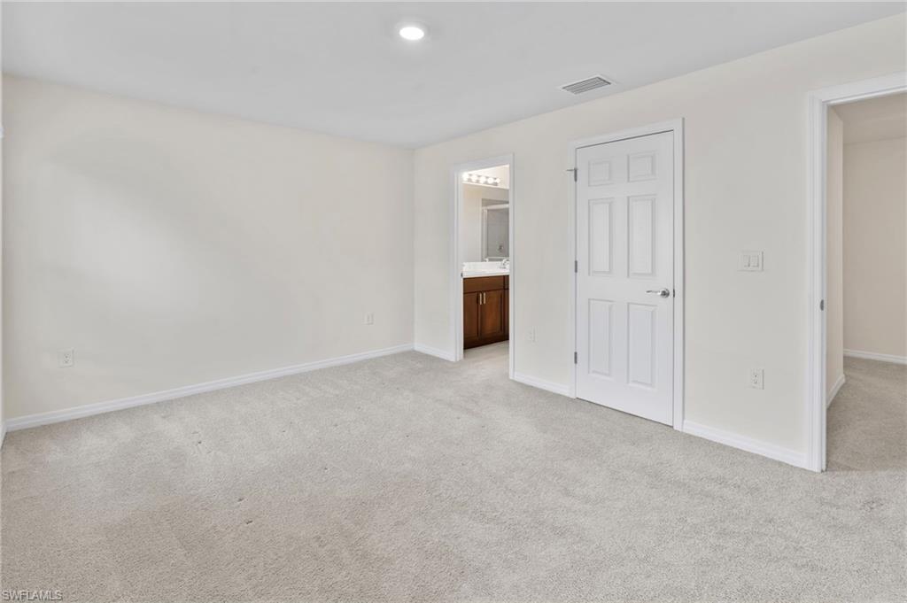 15535 Wildflower Circle Naples, FL 34119 - Photo 17 of 33 a view of an empty room