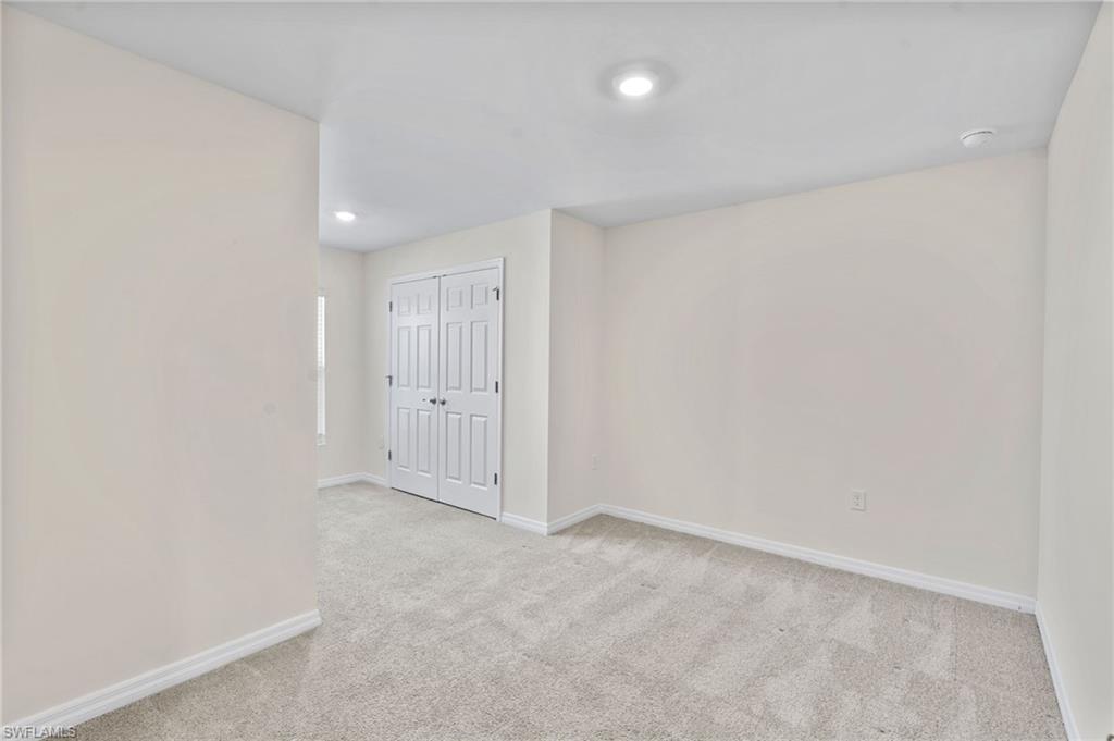 15535 Wildflower Circle Naples, FL 34119 - Photo 20 of 33 a view of an empty room