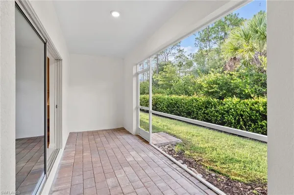 a view of a hallway with windows