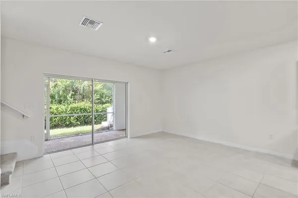 a kitchen with stainless steel appliances a stove refrigerator sink and microwave