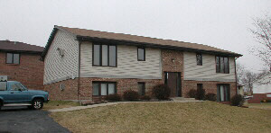 a front view of a house with parking space