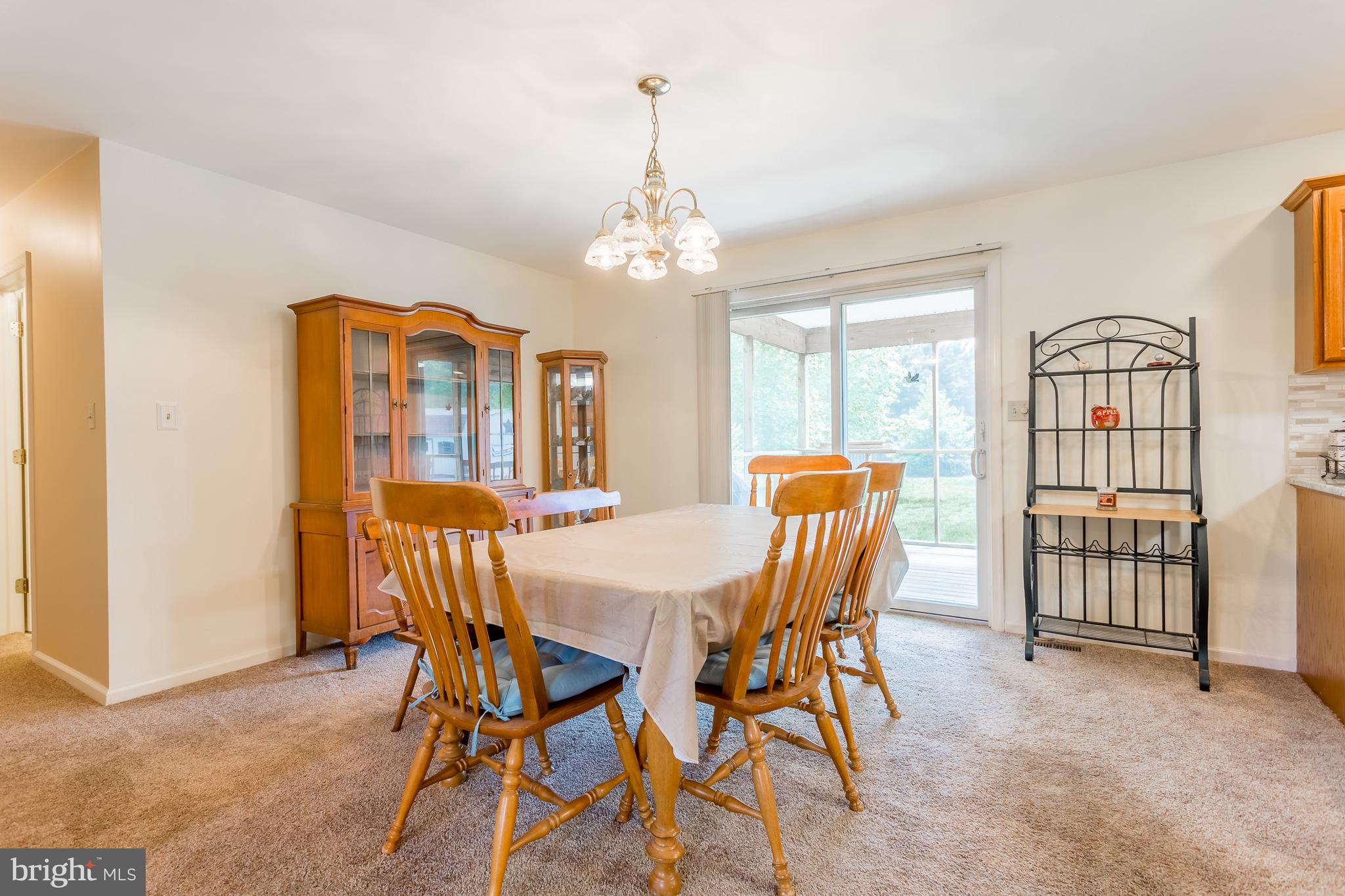 24174 Zoar Road Georgetown, DE 19947 - Photo 11 of 32 DINING ROOM AND SLIER TO REAR SCREENED PORCH
