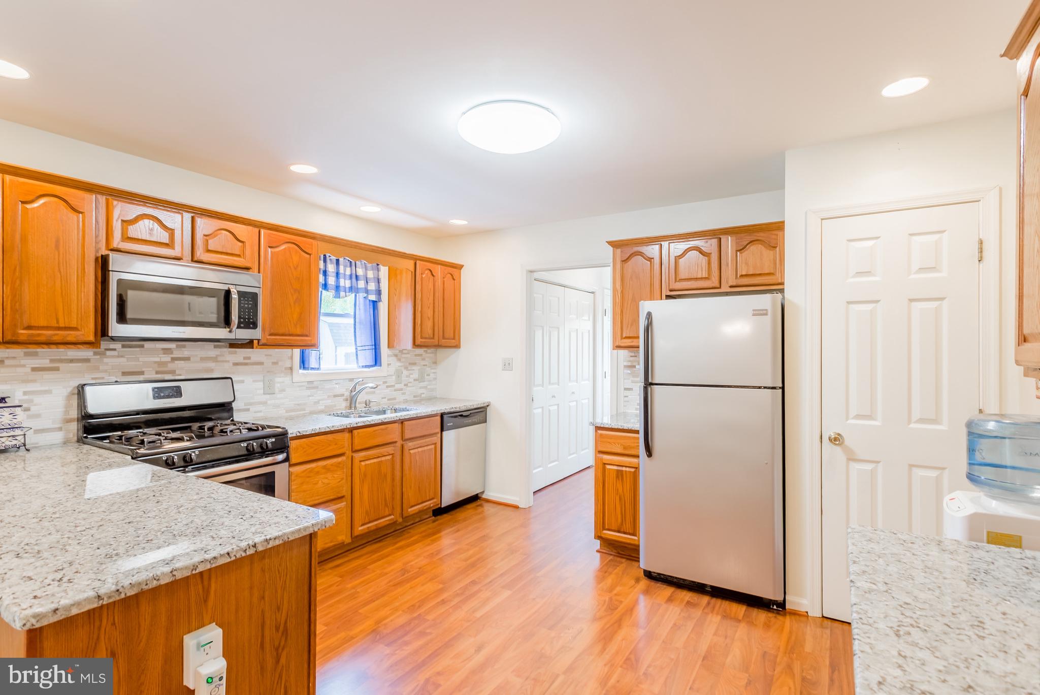 24174 Zoar Road Georgetown, DE 19947 - Photo 13 of 32 RENOVATED KTICHEN WITH STAINLESS STEEL APPLIANCES