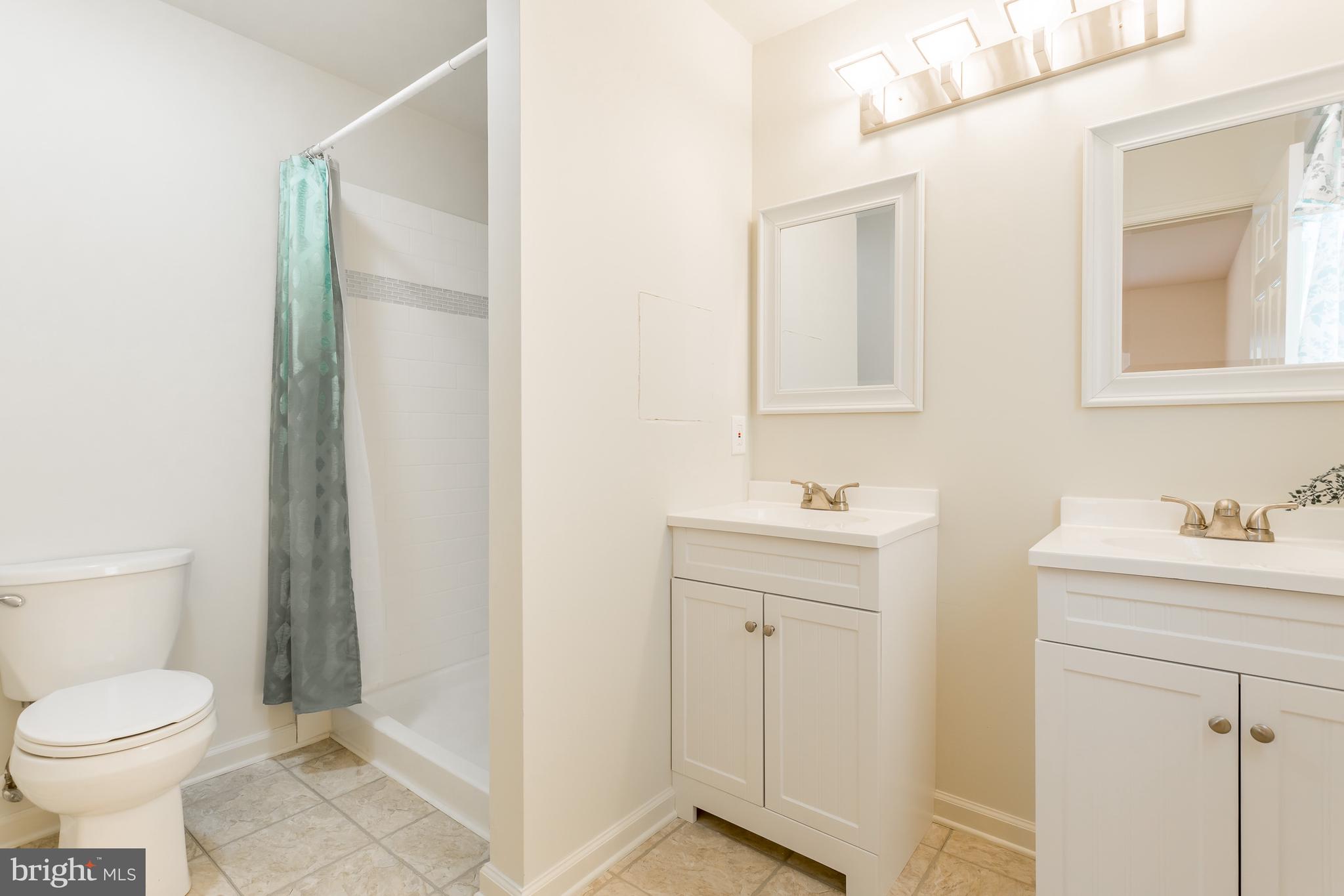 24174 Zoar Road Georgetown, DE 19947 - Photo 18 of 32 RENOVATED MAIN BEDROOM BATHROOM WITH LARGE SHOWER