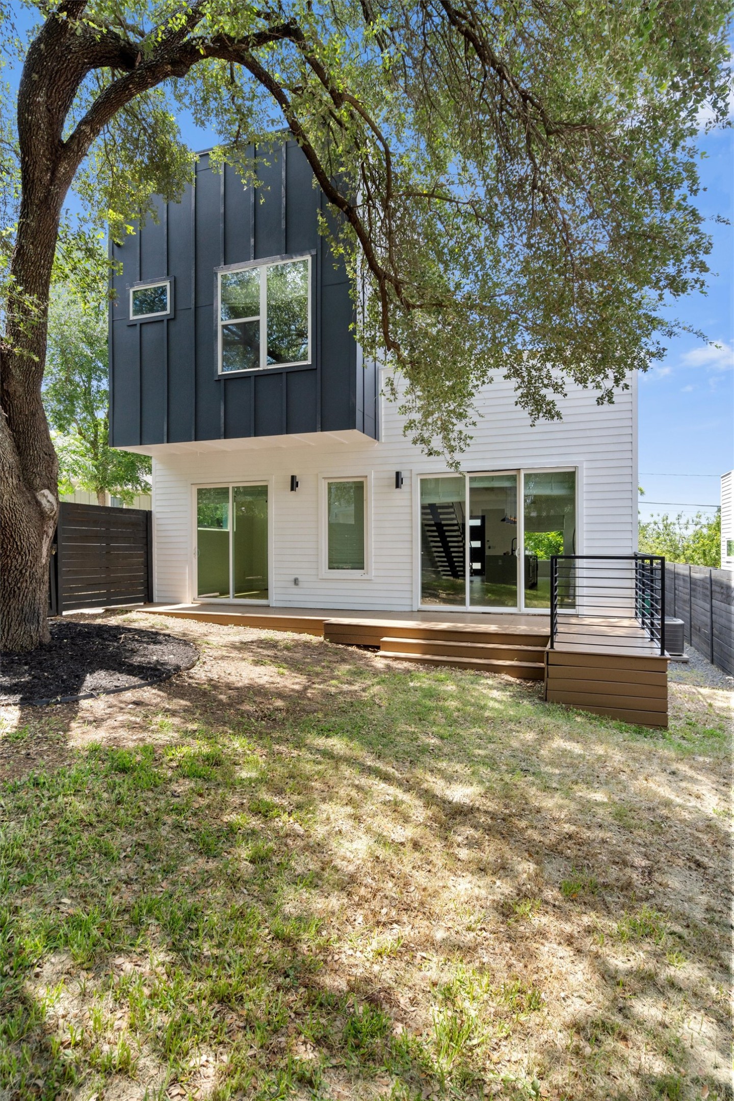 4712 Reyes Street, Unit 1 Austin, TX 78721 - Photo 33 of 38 a view of a house with a yard