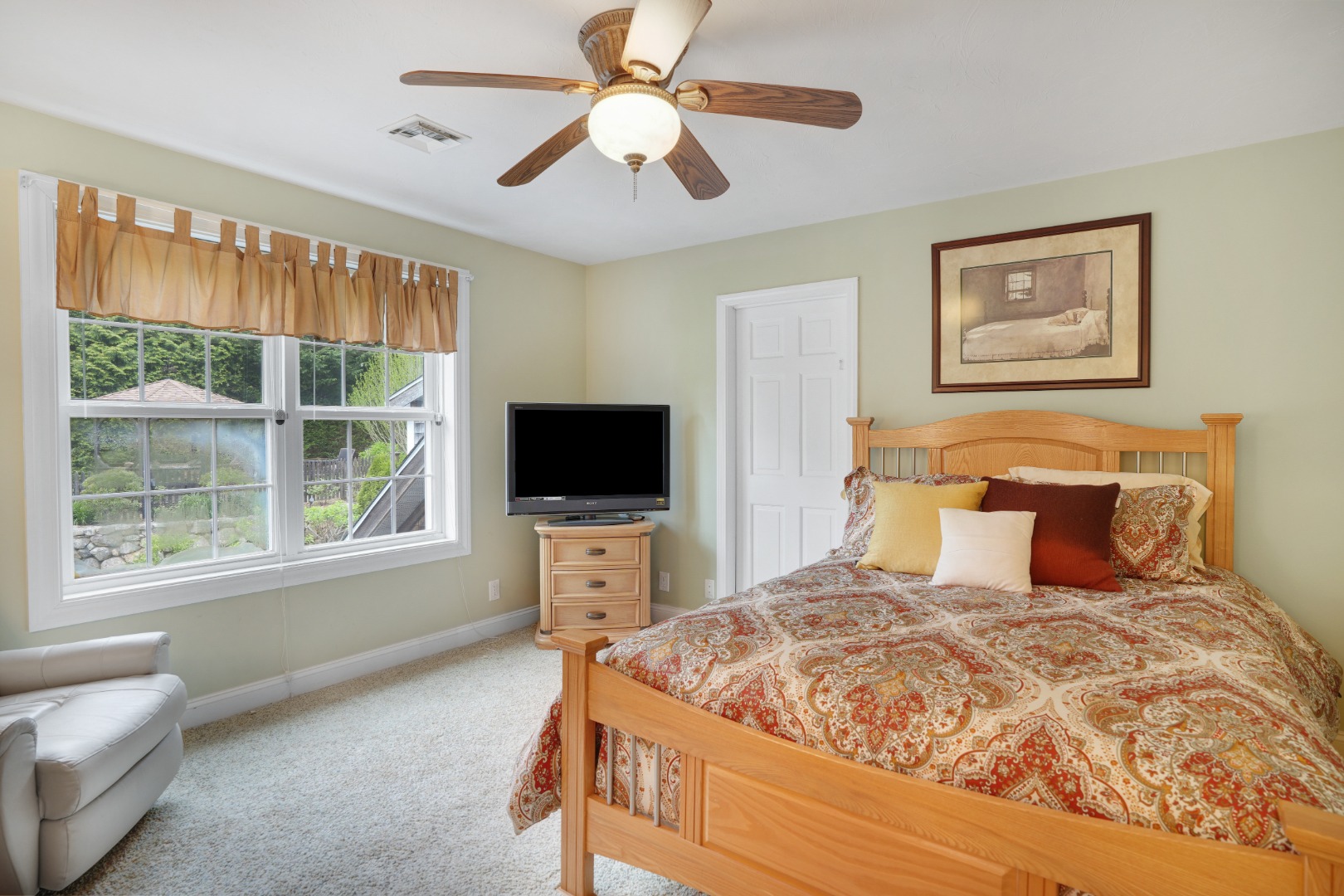 8 Fresh Pond Road Oak Bluffs, MA 02557 - Photo 13 of 36 a bedroom with a bed and a flat screen tv