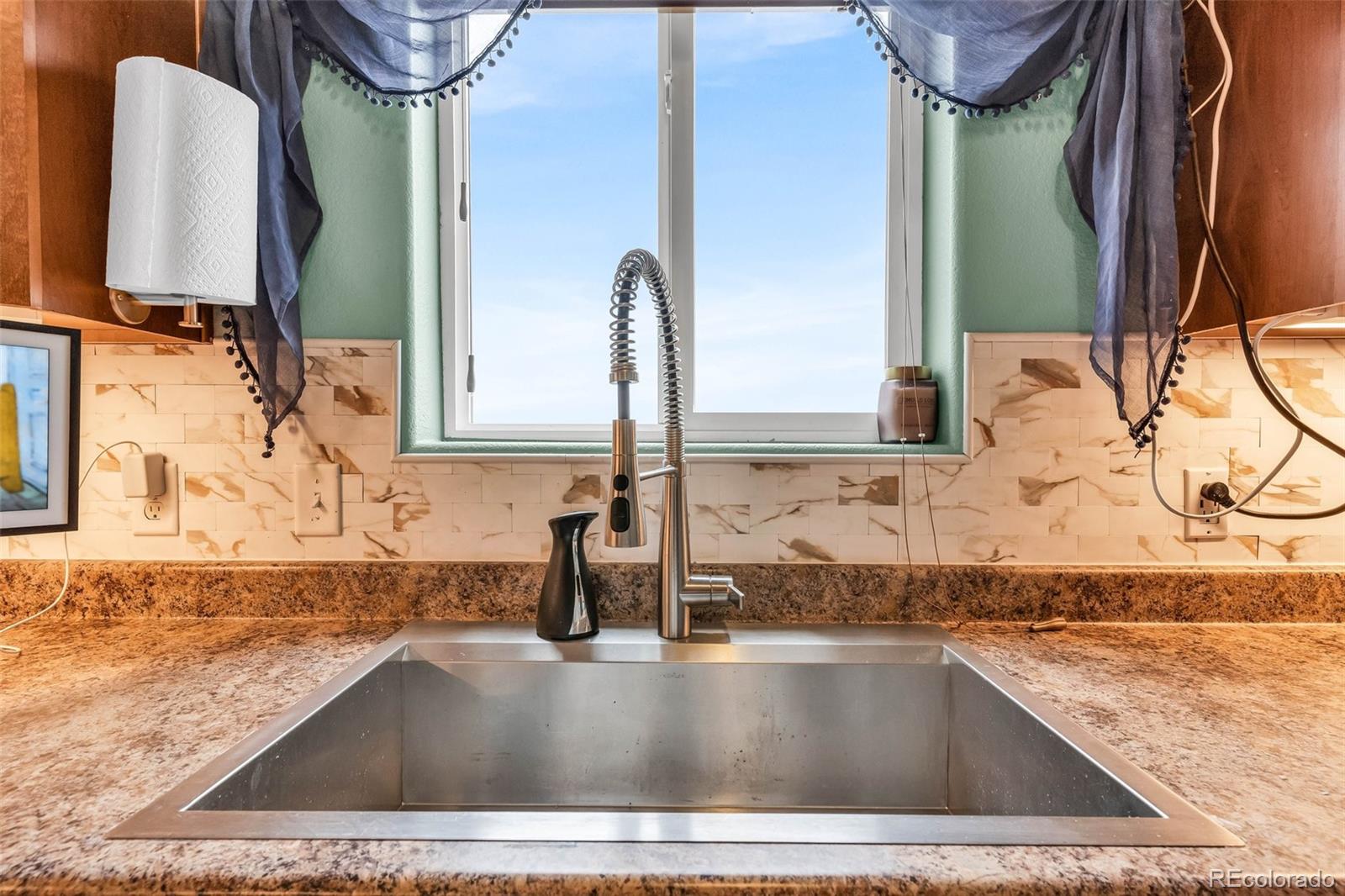 2108 O'Neal Circle Pueblo, CO 81004 - Photo 11 of 39 a view of a kitchen sink