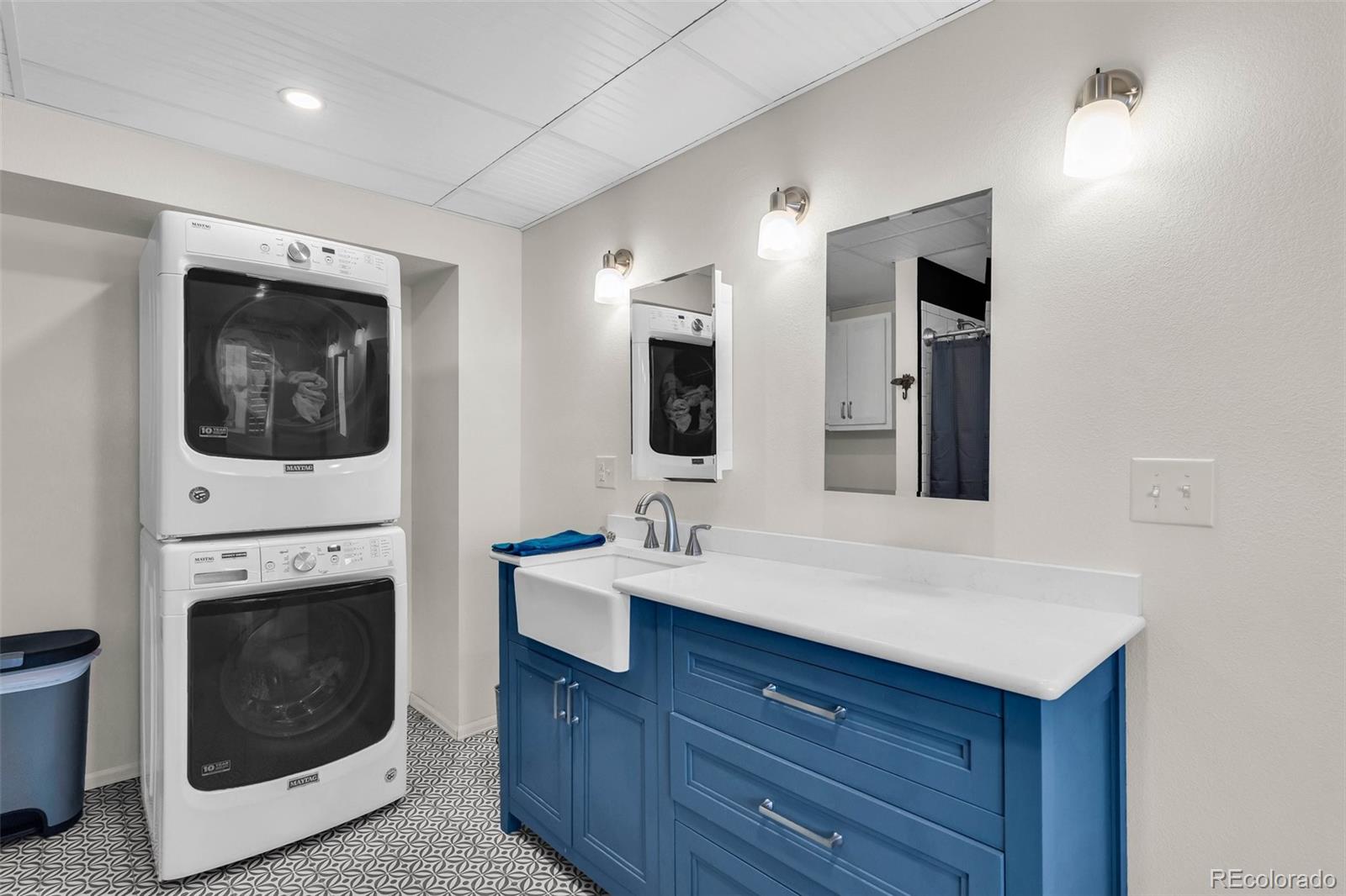 2108 O'Neal Circle Pueblo, CO 81004 - Photo 23 of 39 a bathroom with a sink and a mirror