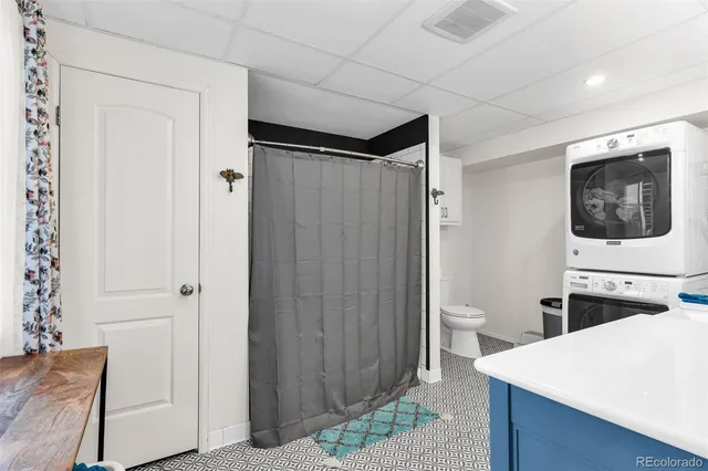 a view of a hallway with washer and dryer