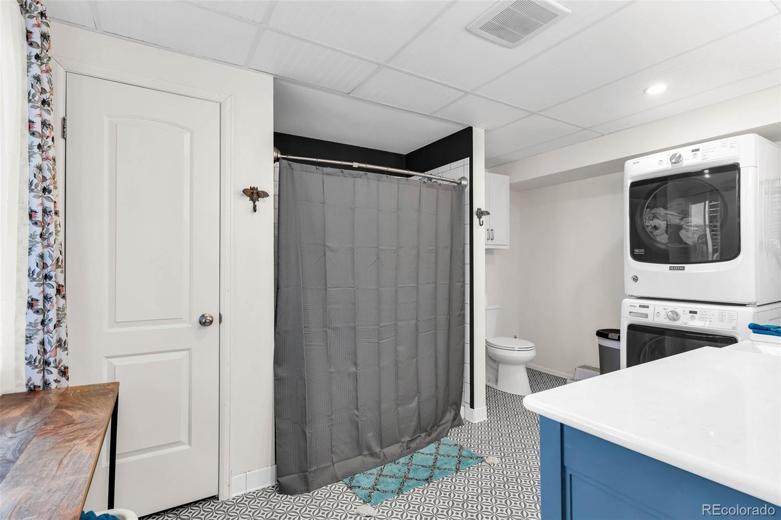 2108 O'Neal Circle Pueblo, CO 81004 - Photo 24 of 39 a view of a hallway with washer and dryer