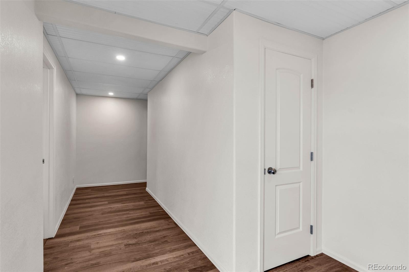 2108 O'Neal Circle Pueblo, CO 81004 - Photo 26 of 39 a view of hallway with wooden floor