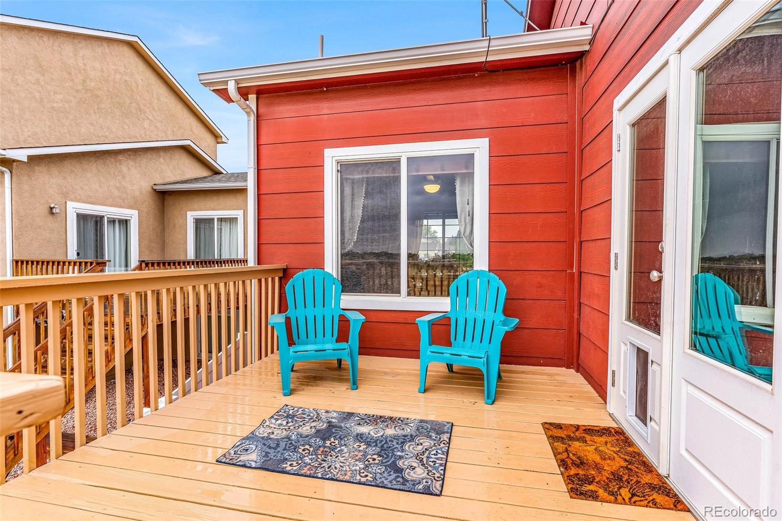 2108 O'Neal Circle Pueblo, CO 81004 - Photo 28 of 39 a porch with furniture and rug