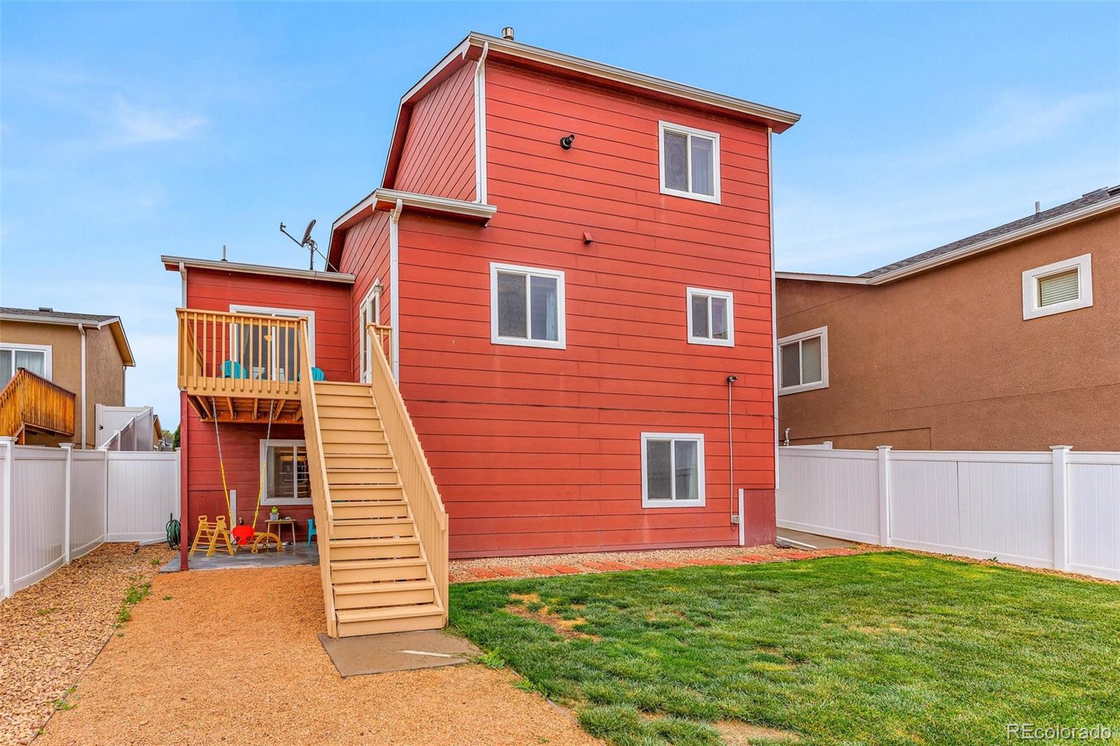 2108 O'Neal Circle Pueblo, CO 81004 - Photo 29 of 39 a front view of a house with a yard
