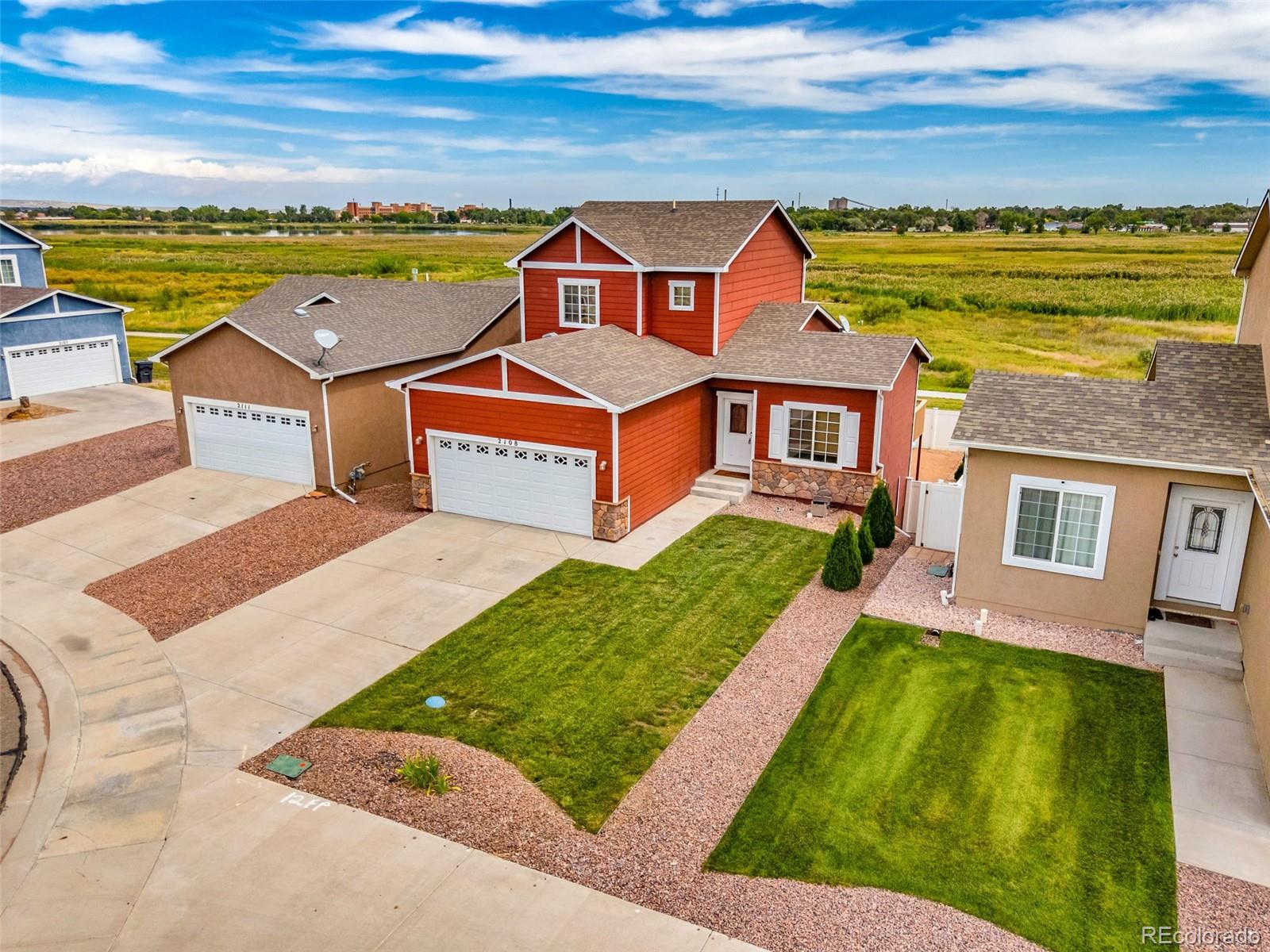 2108 O'Neal Circle Pueblo, CO 81004 - Photo 3 of 39 an aerial view of residential houses with outdoor space and ocean view