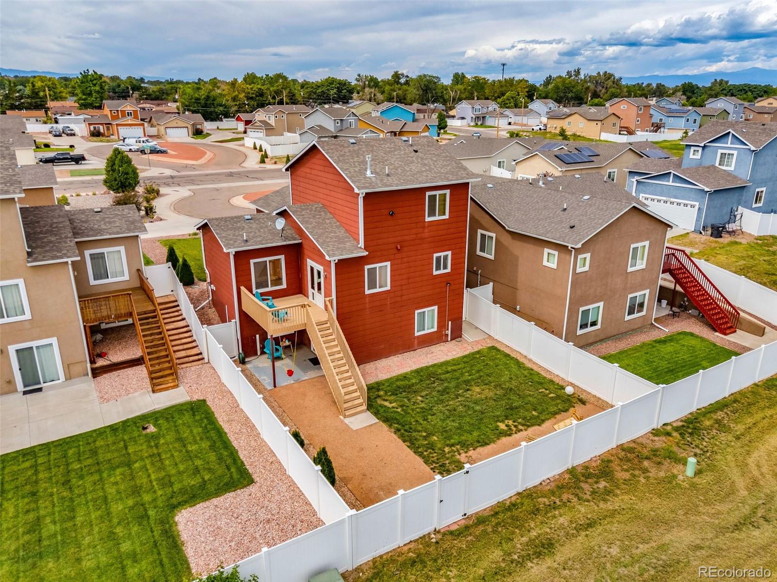 2108 O'Neal Circle Pueblo, CO 81004 - Photo 31 of 39 an aerial view of residential houses with yard