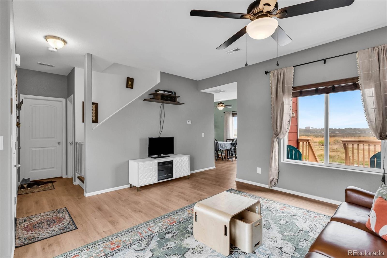 2108 O'Neal Circle Pueblo, CO 81004 - Photo 6 of 39 a living room with furniture and a flat screen tv