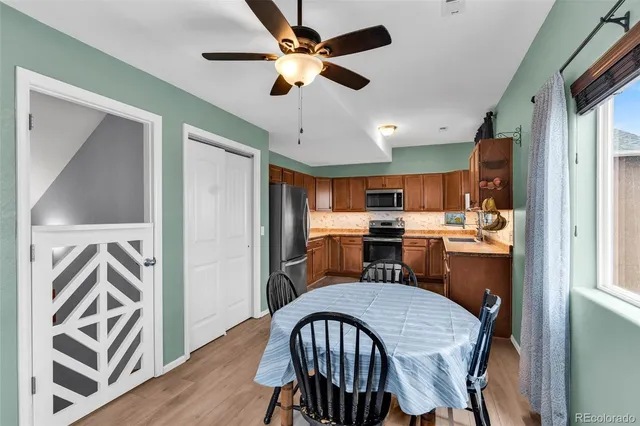 a view of a dining room with furniture window and wooden floor