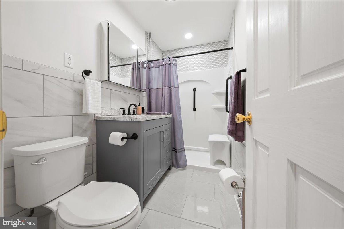 484 Centerton Road Bridgeton, NJ 08302 - Photo 14 of 49 a bathroom with a sink a toilet and a shower