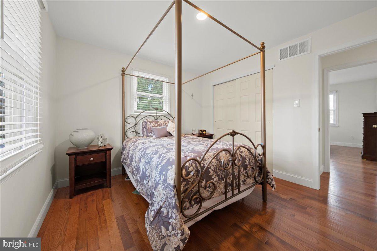 484 Centerton Road Bridgeton, NJ 08302 - Photo 18 of 49 a bed sitting in a bedroom next to a window