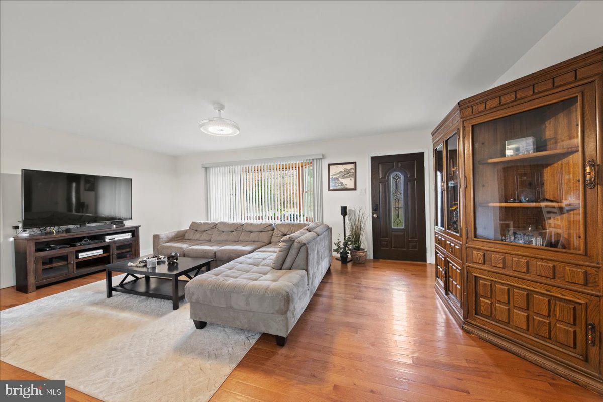 484 Centerton Road Bridgeton, NJ 08302 - Photo 2 of 49 a living room with furniture and a flat screen tv