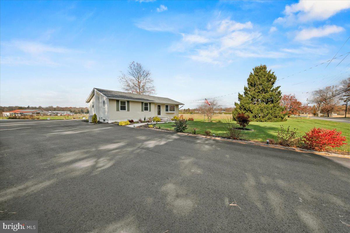 484 Centerton Road Bridgeton, NJ 08302 - Photo 36 of 49 a front view of house with yard and trees in the background