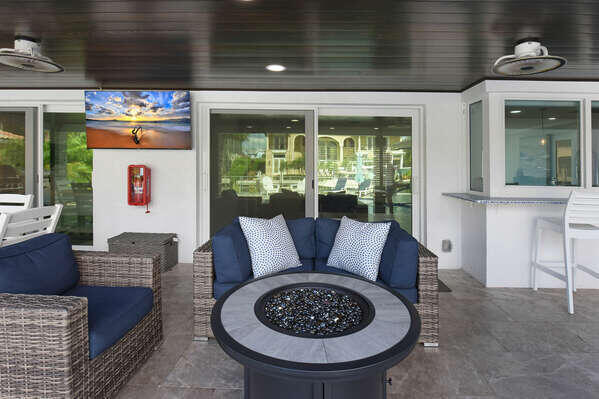 839 Enfield Street Boca Raton, FL 33487 - Photo 25 of 36 a living room with furniture a fireplace and a floor to ceiling window