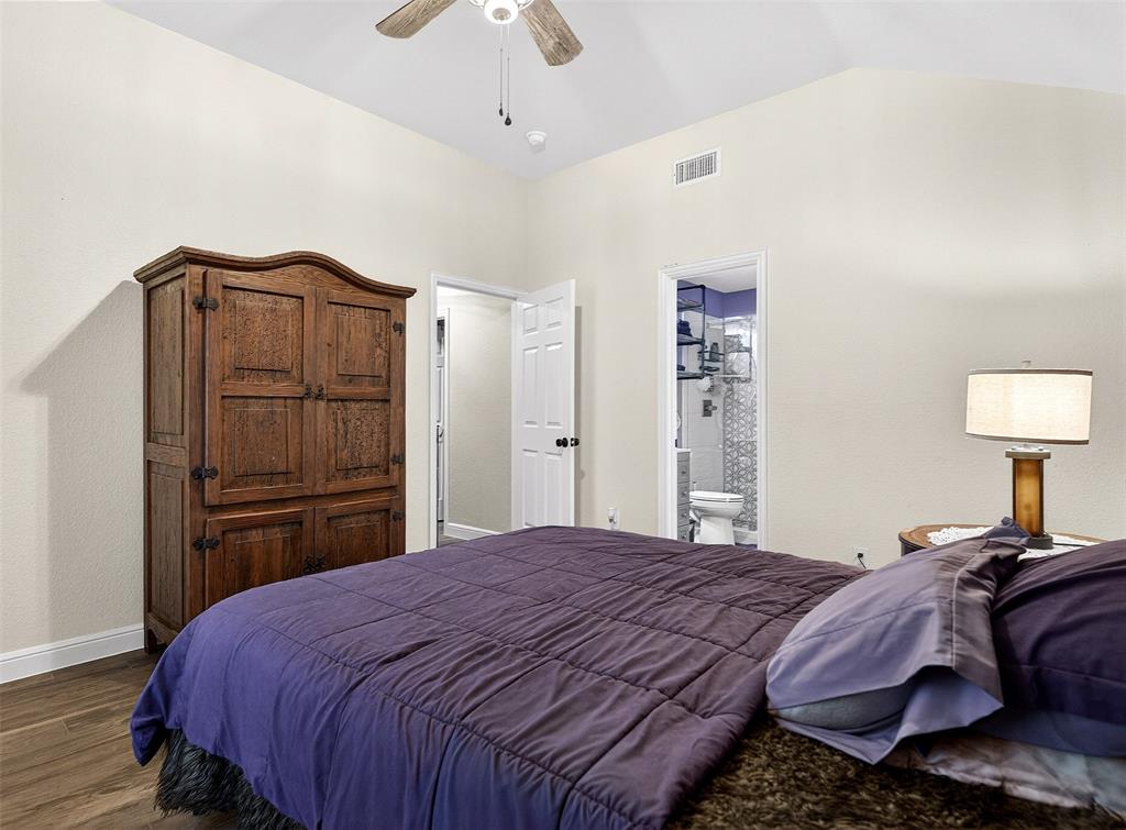 1006 Oakchase Court Azle, TX 76020 - Photo 13 of 19 a bedroom with a bed and a closet