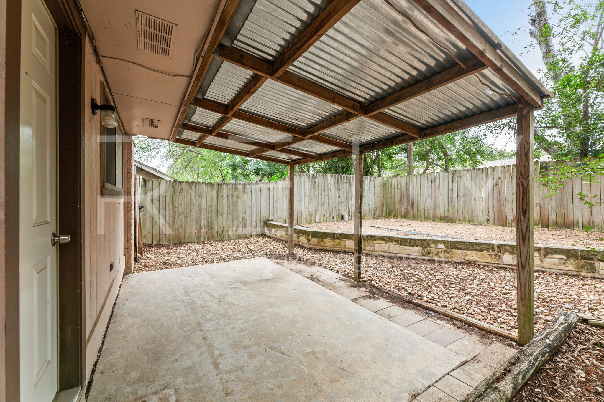 1005 Milford Way, Unit A Austin, TX 78745 - Photo 27 of 30 a backyard of a house with a barn