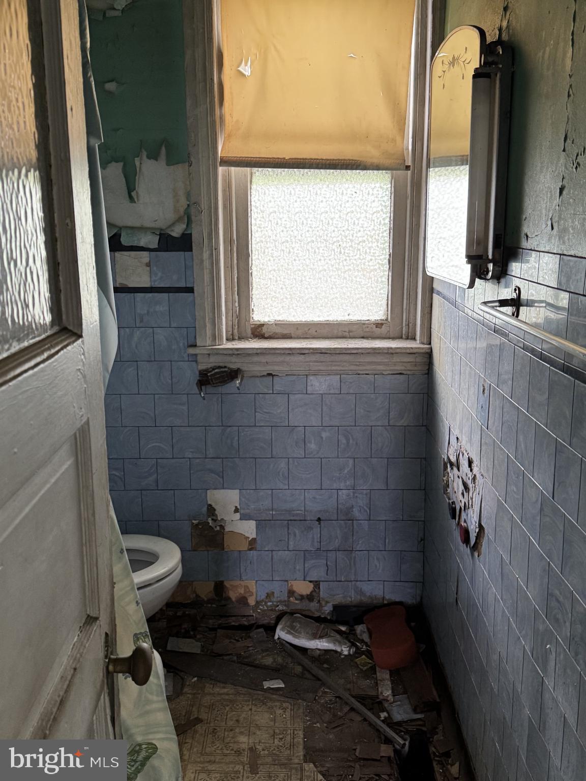 1120 West 9th Street Chester, PA 19013 - Photo 3 of 6 a bathroom with a sink and a toilet
