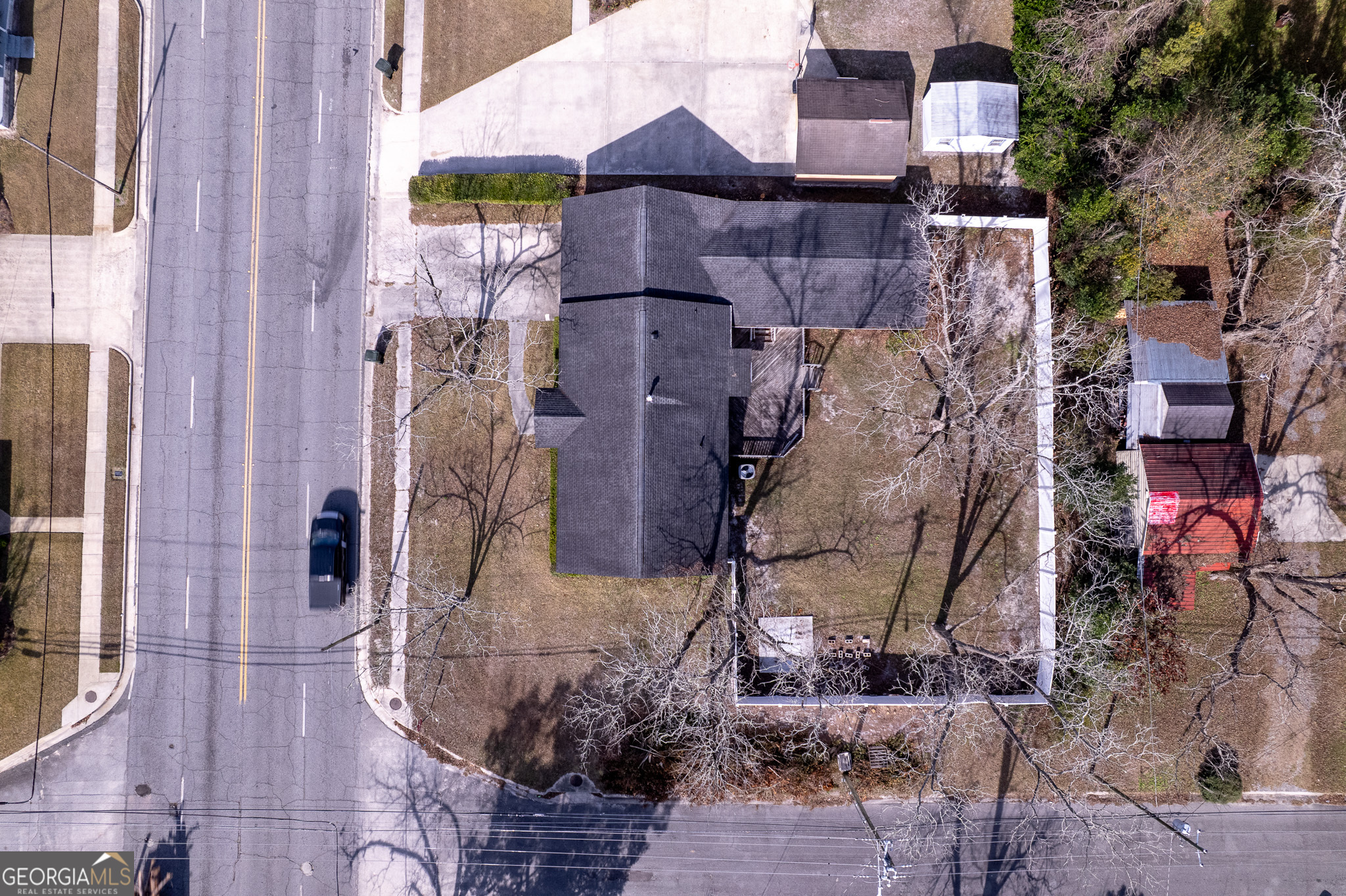 1615 Brunel Street Waycross, GA 31501 - Photo 25 of 28 a aerial view of a house with a yard and large tree