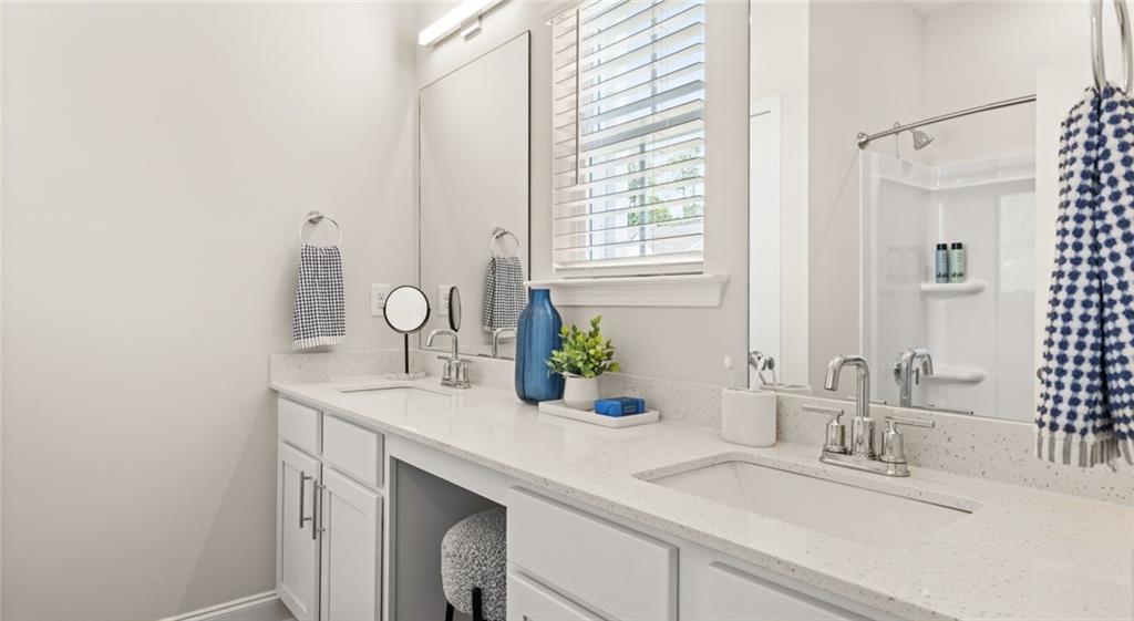 100 Rosemoore Drive Covington, GA 30014 - Photo 9 of 41 a bathroom with a sink and a mirror