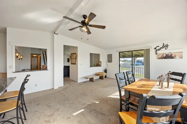 a dining room with furniture and window