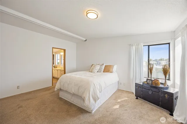 a bedroom with a bed and a couch