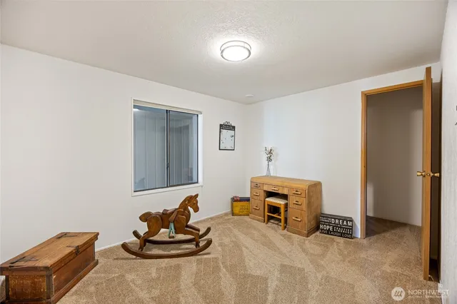 a bedroom with a bed and a couch