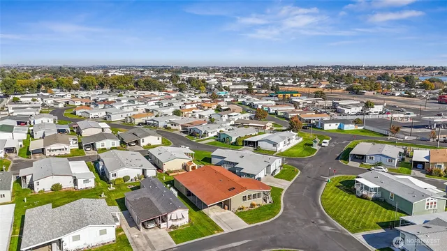an aerial view of a house with a garden and a yard