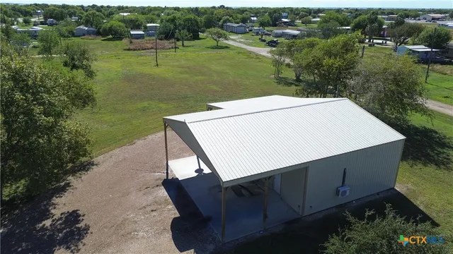 an aerial view of a house having yard