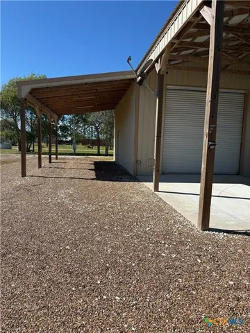 a view of a backyard with porch
