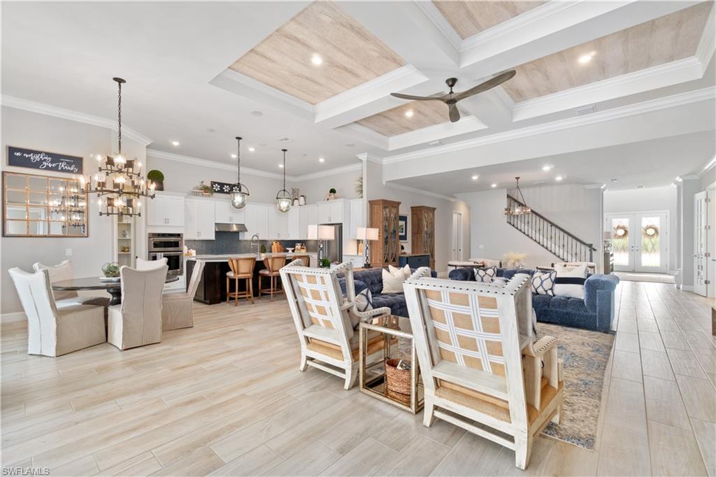 14367 Pine Hollow Drive Estero, FL 33928 - Photo 11 of 50 a room with lots of chairs and view of living room